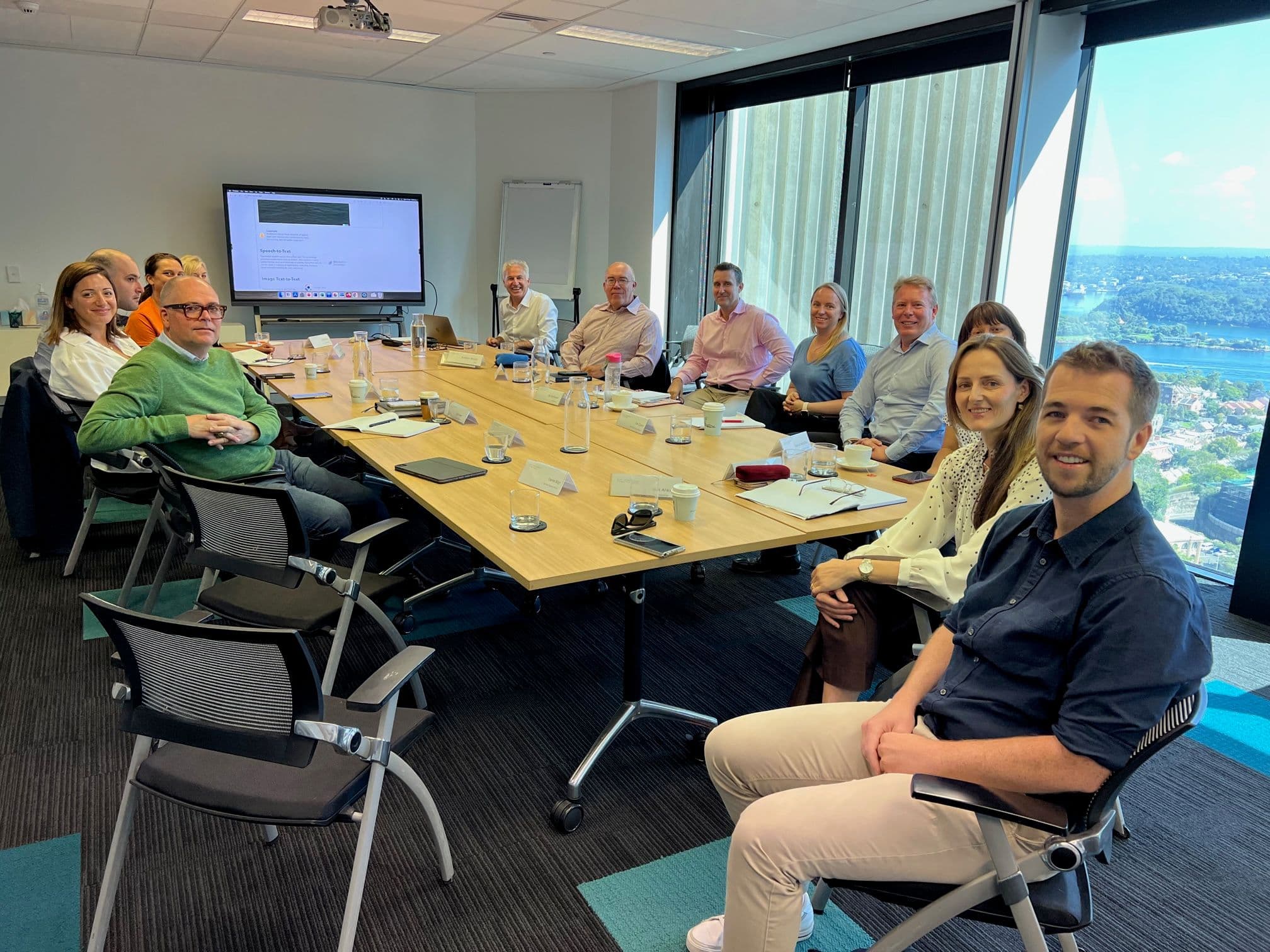 An LTT peer group meeting around a boardroom table